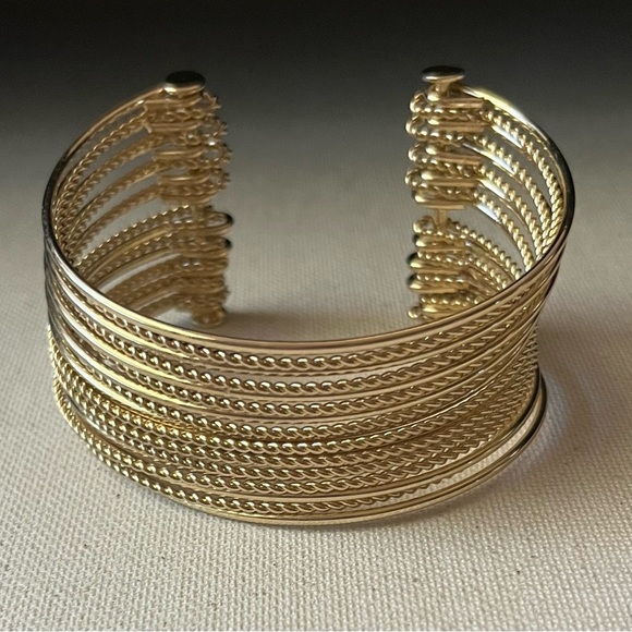 Elegant Gold Tone Cuff Bracelet - Picture 1 of 4